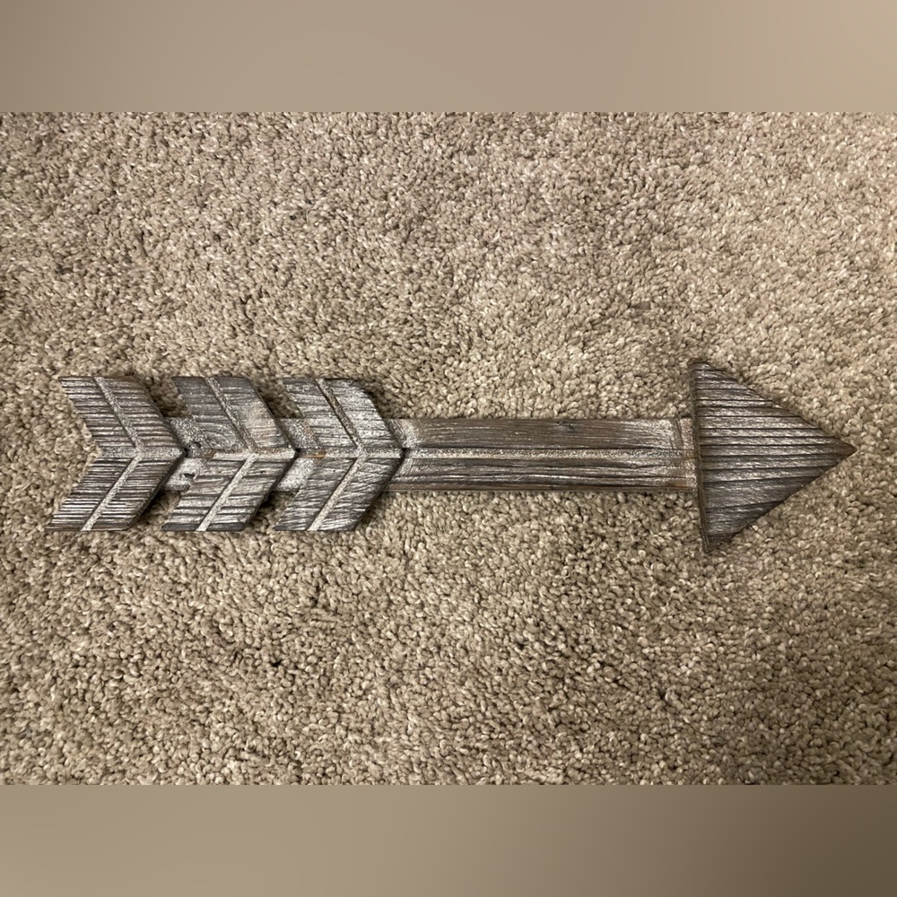 White brushed wooden arrows. Wall decor